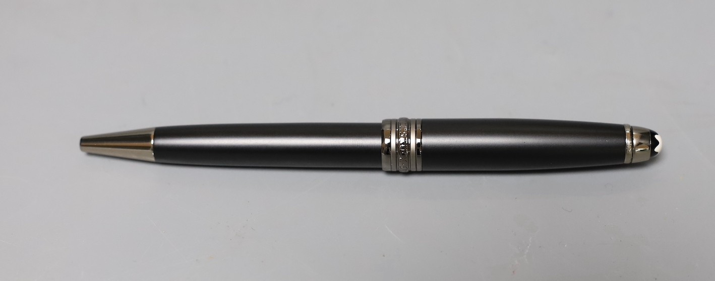 A Mont Blanc retractable ball point pen with original case, cardboard sleeve and service instructions